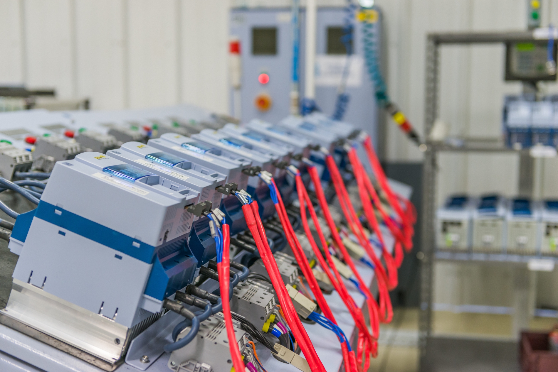 Row of VFDs ready for installation and pairing with electric motors for industrial motor performance.