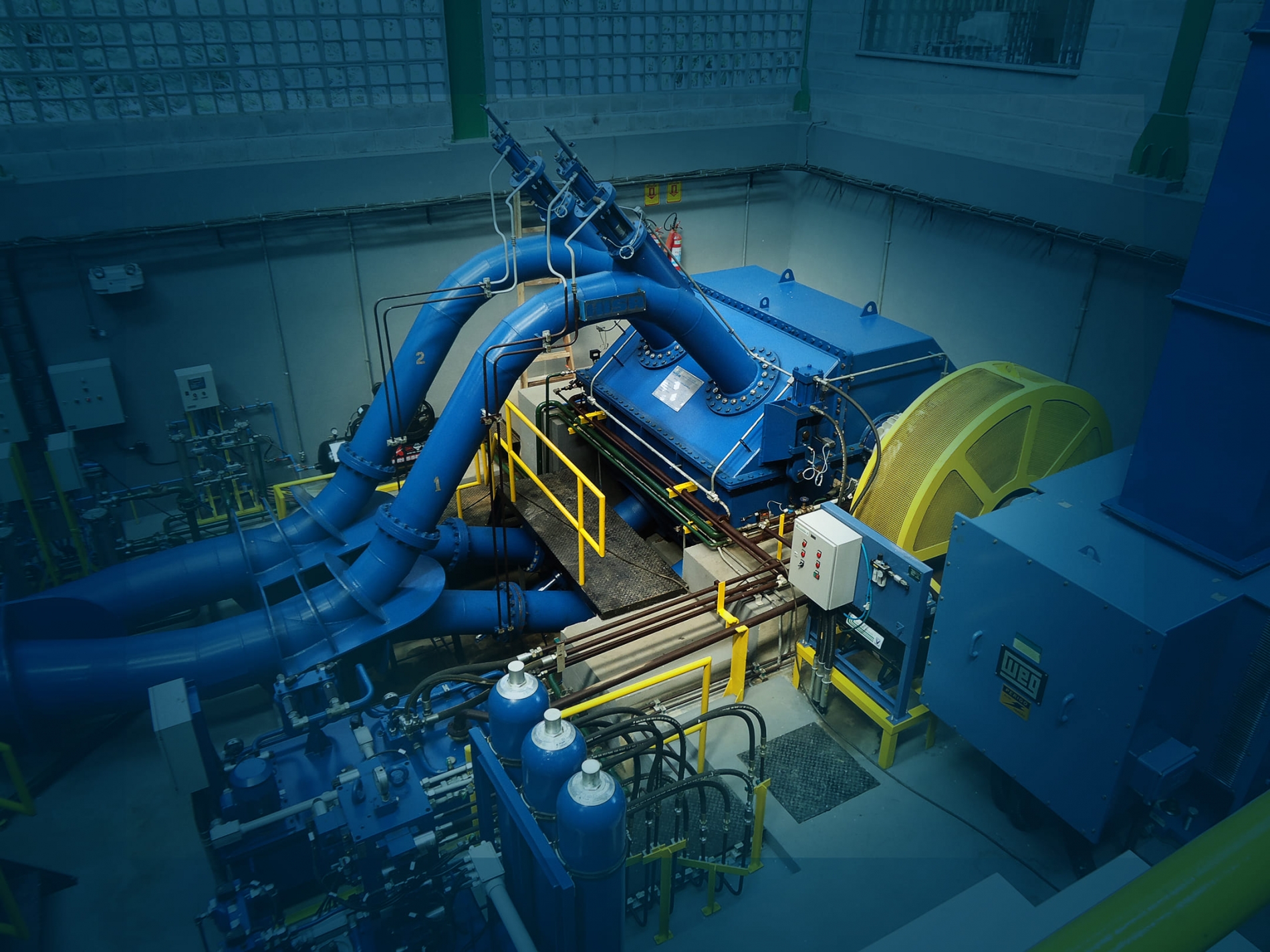 High-efficiency AC motor installed inside an industrial electrical enclosure.